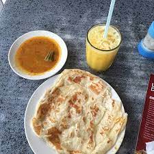 This is not your typical roti canai, their dish is probably one of the most unique ones in town! Roti Canai With Fresh Orange Juice Picture Of Sk Corner Kuala Lumpur Tripadvisor