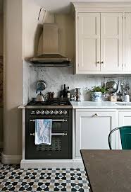 A dark grey shaker style kitchen with open compartments, butcherblock countertops, a. Kitchen Backsplash Shaker Kitchen Tile Backsplash