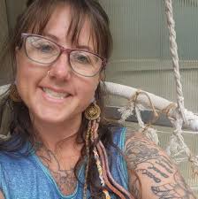 Where to find tattoo parlors in Michigan with get what you get gum ball  machines?