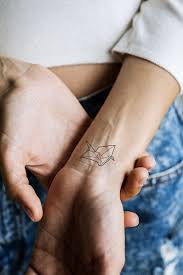 Download Premium Psd Of Close Up Of Tattoo On The Wrist Of A Woman 383856 Tattoos Hand Tattoos Triangle Tattoo