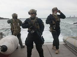 Alarm drill of an armed m.r.u. Members Of The Coast Guard S Maritime Security Response Team Secures The Aft Deck Of A Vessel During An Exercise In Boston Harbor Tuesday Oct 20 2015 Militar