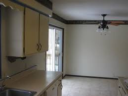 Decorating with yellow walls in a living room is one way to bring instant cheer. 3 Yellow Paint Colors Later Still Not Gold