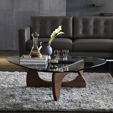 The solid wood frame displays a warm walnut finish and supports a tempered glass table top, creating a clean and open look. Classics Isamu Noguchi S Coffee Table Milk Concept Boutique