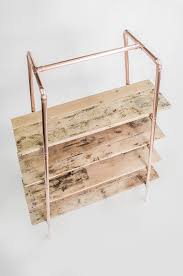 There are essentially three separate structures that make up this industrial pipe shelving as long as no one is hanging on the shelves, they are fine secured at the top and not screwed into the floor. Pin On Open Shelving