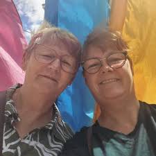 What is the best way to clean an old painting without damage?