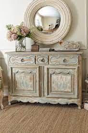 Antiqued Credenza And Rustic Round Mirror Country House Decor French Country Furniture Home Decor