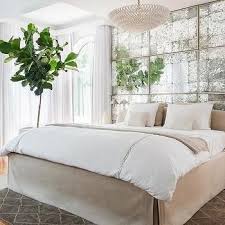 Antiqued Mirrored Headboard Panels With Slipcovered Bed Bedroom Design On A Budget Mirror Wall Bedroom Mirror Headboard