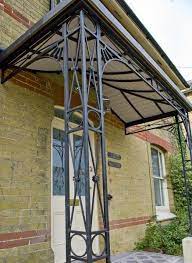 Manufacturer of wrought iron components and leading supplier of wrought iron components and wrought iron fabrications to the trade and industry. Georgian Style Corner Entrance Porch In Black Painted Finish With Traditional Lead Roof Canopy Wrought Iron Porch Railings Balcony Railing Design Porch Columns