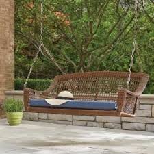 Hampton Bay Spring Haven Brown 2 Person Wicker Outdoor Swing With Blue Cushion 65 10389q The Home Depot Wicker Porch Swing Porch Swing Patio Swing
