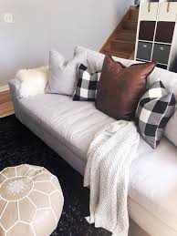 Value City Furniture Ethan Sofa In Dudley Gray With Buffalo Check Pillows Leather Pillow Moroccan Pouf Value City Furniture Furniture Buffalo Check Pillows