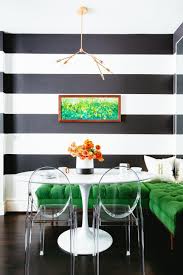 Black And White Dining Room Sets This White Contemporary Kitchen Features A Black And White Accent Wall As Well As An Eat I Black And White Dining Room White Dining Room White Dining Room Sets