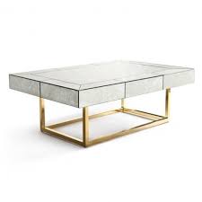 Featuring mirrored finish base and trim. Delphine Antiqued Glass Gold Coffee Table