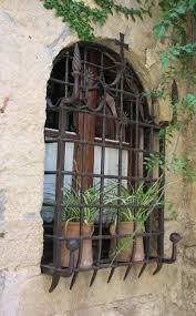 Casa del herrero window grille iron gates, guards and railings on pinterest spanish wrought iron grilled. Love The Wrought Iron Over Windows But I D Need A Way To Escape A Fire Spanish Style Homes Iron Window Spanish Style