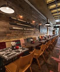 reclaimed timber cladding with scrable artwork diseno de restaurante bar arquitectura de restaurante interior de cafeteria
