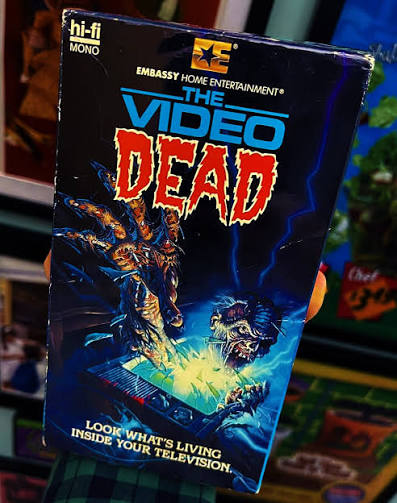 Tonight's movie: The Video Dead, from 1987. A longtime fave, it's the story of  a cursed TV set that spews out real life zombies. This was one of the  cassette boxes that