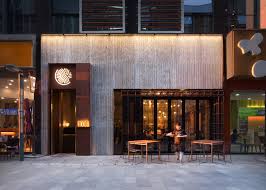 Shanghai Based Lukstudio Has Reinterpreted A Traditional Chinese Food Drying Rack With A Metal Grid Structure A Restaurant Facade Cafe Design Storefront Design