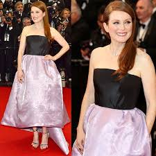 Julianne moore's bare feet as she is removing her feet from some shoes. Julianne Moore Calls Her Cannes Foot Crisis For Toemageddon