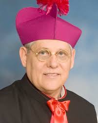 The Fake Priest Accused of Swindling Millions