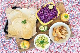 Stack two tortillas together, and place 1/2 of a fish fillet onto each stack. Fish Tacos With Cabbage Slaw And Gluten Free Tortillas Food Matters