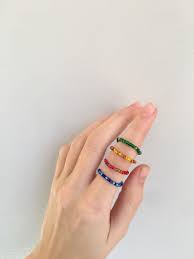 Set Of Four Rainbow Colored Glass Bead Rings Stack Of Glass Etsy In 2020 Beaded Jewelry Seed Bead Jewelry Beaded Rings