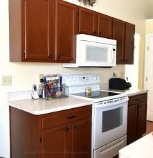 This cabinet transformation kit includes paint that will cover 102 square feet of cabinet surface, which will be enough for most cabinets. Kitchen Cabinet Redo Joyful Homemaking