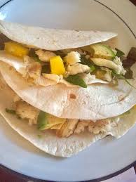 Stir mango, avocado, tomato, red onion, red pepper, parsley, canola oil, brown sugar, lime juice, cider vinegar, hot pepper sauce, salt, and ground black pepper together in a bowl. Mango Fish Tacos Simple Green Moms