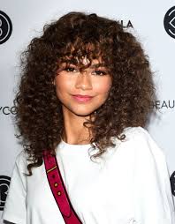 If your fine, straight hair doesn't hold a curl, consider cutting it into a style that has a side or center part and long, feathered bangs that frame the face. See How To Style Curly Hair And Bangs The A List Way