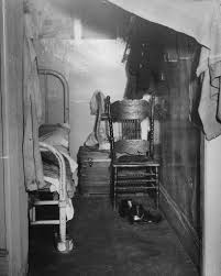 This tenement bedroom may appear simple, but it holds countless stories.  Within tight spaces, carefully stored belongings, immigrant families found  ways to make a place feel like home. What details stand out