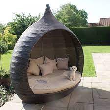 And when you're not reclining, you can use the daybed as a seating area. Maze Rattan Pear Shape Daybed Garden Furniture Brown Discount Rattan Furniture In 2020 Lounge Chair Outdoor Modern Patio Furniture Outdoor Daybed