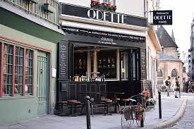 A cream puffs counter is located on the ground floor of the small 17th century building in the heart of the 5th. Odette Paris