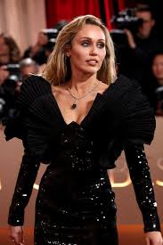 Miley Cyrus Pairs a Classic Black Sequin Gown With Unexpected Sunglasses at the Golden Globes