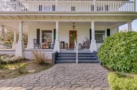 Wraparound porches line at least two sides of a house. On The Market Homes For Sale With A Wraparound Porch To Socialize From A Distance Oregonlive Com