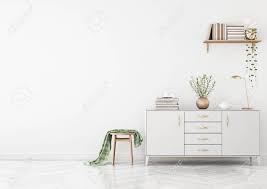 Whereas the wood drawer design of a bedroom chest will look and feel different from the living room one. Clean Living Room Interior With Chest Of Drawers Stool Plaid Stock Photo Picture And Royalty Free Image Image 140453150