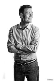 Modern interior office design with row black chairs and wooden table with window and building view background in black and white t. Black White Portrait Of Man On White Background White Background Portrait Black And White Portrait Black And White Photography Portraits