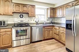 This Is What Does Not Appeal To Me Combo Of Wood Cabinets Wood Floor And Dark Counter Wood Cabinets Dark Counters Fair Oaks