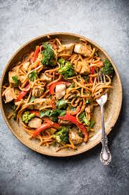 Chicken breast chunks are marinated in ginger and lime, stir fried with sesame oil and honey, then served with coconut rice. Spicy Thai Peanut Chicken Sweet Potato Noodle Stir Fry Ambitious Kitchen