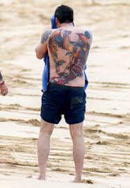 Let me first say that as a tattoo artist, i'd like to think that ben affleck would go to someone reputable. Ben Affleck Talks Phoenix Back Tattoo Love On Ellen