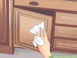 How to clean kitchen cabinets. 3 Ways To Clean Laminate Cabinets Clean Laminate Laminate Cabinets Wood Cabinet Cleaner