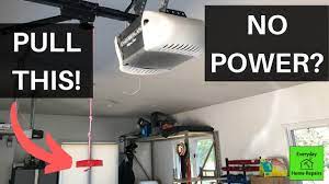 Genie garage door openers are attached to the ceiling of the garage. 3 Ways To Open Garage Door Manually Without Power