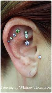 Piercingbywhitney Fresh Quad Helix Wth Descending Peridot Amp Amethyst Faceted Gems Jewelry From Anatometal Heale Cool Piercings Cute Piercings Piercings