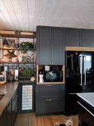 Dark gray flat front kitchen cabinets with gray mosaic tile. Grey Kitchen Cabinets With Wood Grey Kitchen Cabinets Kitchen Cabinet Design Kitchen Cabinets