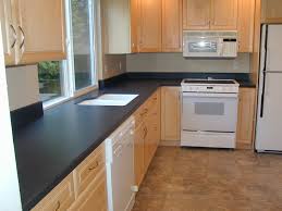 Laminate counters are highly heat resistant. White Kitchen Cabinets With Black Laminate Countertops Novocom Top
