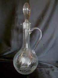 This is called a traditional decanter, but the stylish and classic lines make the decanter more an heirloom in the making than anything else. Vintage Etched Glass Carafe With Glass Stopper Glass Pitcher With Stopper Juice Sets Carafes Home Living