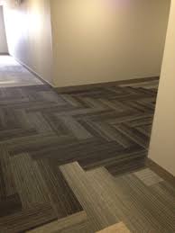 Location The Residences At La Cantera In San Antonio Product Walk The Plank Installed Herringbone Carpet Tiles Walking The Plank Home Decor