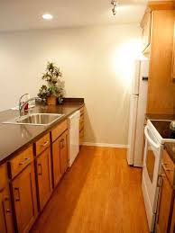 Charleston cherry, charleston toffee, and white shaker elite kitchen cabinets are all examples of lily ann cabinets that run the spectrum of colors and still match well with stainless steel cabinets. White Appliances Black Countertops Wood Cabinets White Kitchen Cabinets With Black Granite Kitchen Design Kitchen Design Small