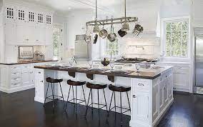 This kitchen offers a large and long center island finished in black and has space for a breakfast bar paired with modern bar seats and is lighted by a. Pin On Homearama