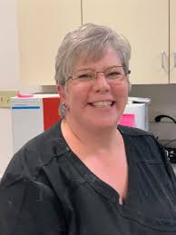 Today, in honor of National Veterinary Technician Week, we're celebrating  Grace, our amazing registered veterinary technician! Grace (center) brings  a cheerful attitude and can-do spirit to everything she does, from caring  for