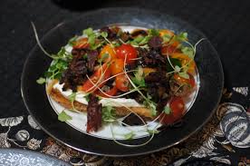 Place bread slices on grill. A Most Unusual Bruschetta Goat Cheese Mousse On Toast With Tomato Salad And Crispy Pastrami Remcooks