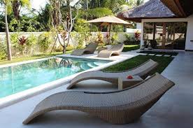 The grounds consist of four beautiful, traditional, antique javanese teak villas with a spectacular pool as the center piece. Candi Kecil Tiga Ubud Bali Indonesia