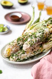 This grilled corn recipe is coated with a cooling lime crema, spiced with some chile powder, and topped with crumbled add your choice of toppings. Mexican Street Corn 2 Ways On The Cob Off The Cob Foolproof Living